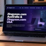 A open laptop on a wooden desk displaying the home page of the Zingyzon website.