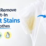 A white t-shirt armpit area transitions from heavily yellow-stained on the left to perfectly clean and white on the right, separated by a diagonal line and a blue arrow pointing to the clean version.