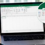 An open laptop sits on a wooden desk, displaying a Microsoft Excel spreadsheet with a callout highlighting the Developer tab.
